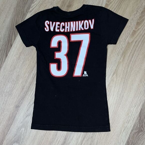 NWOT Girl Carolina Hurricanes 37 Andrei Svechnikov Black Flags Logo Jersey shirt - Picture 1 of 2